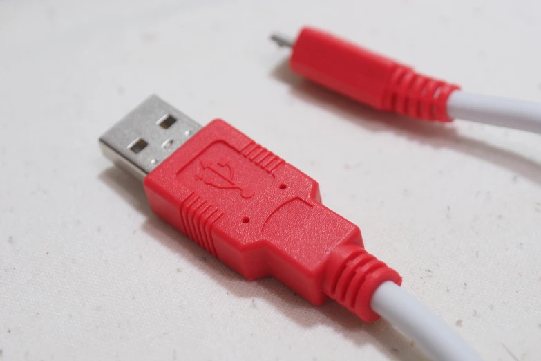 there is one red usb type - c device connected to another