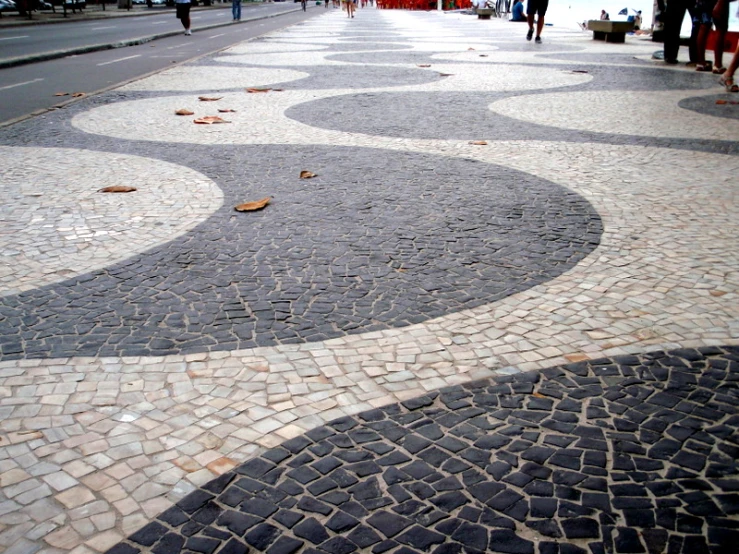 a cobblestone street is surrounded by small steps