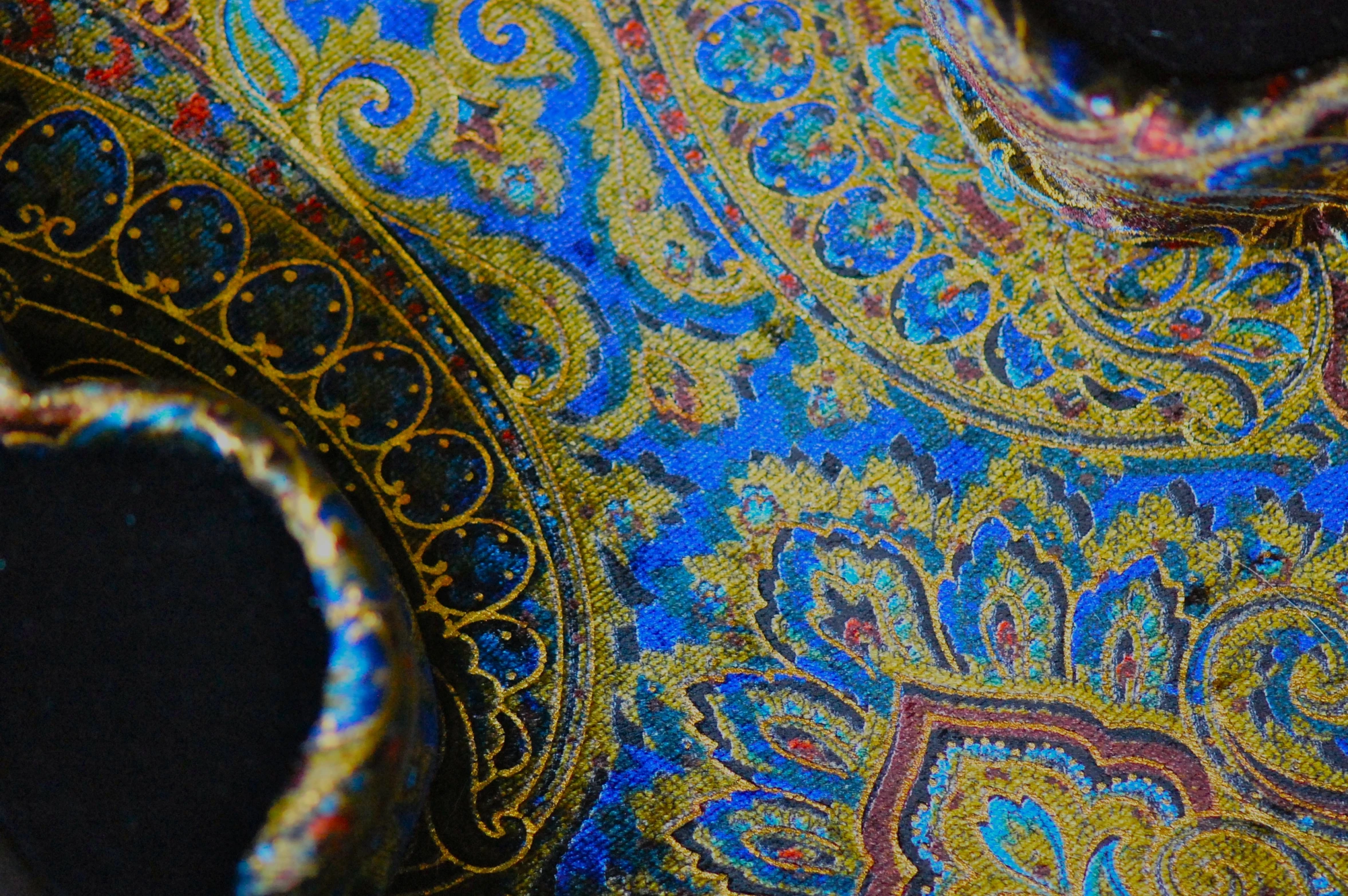 the details of a blue and gold patterned cloth