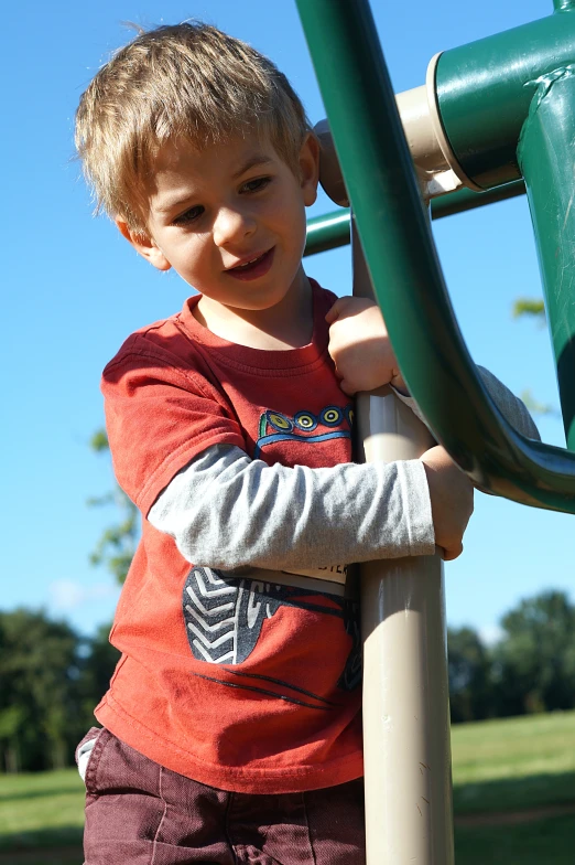 a  standing near a playground