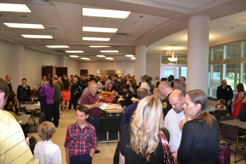 large gathering in a el lobby full of people