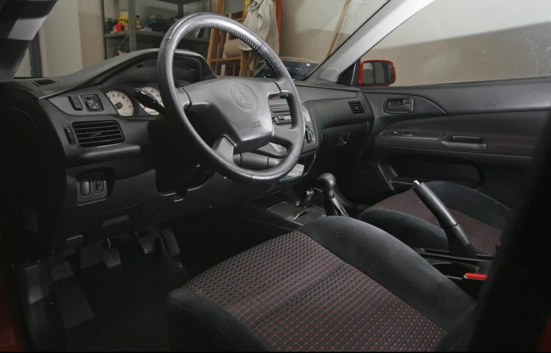 a car with its dashboard showing steering wheel