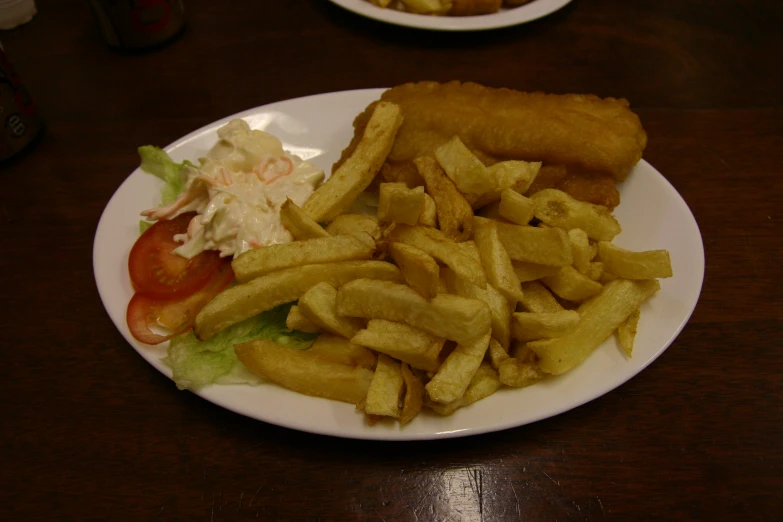 a white plate topped with fries and french fries