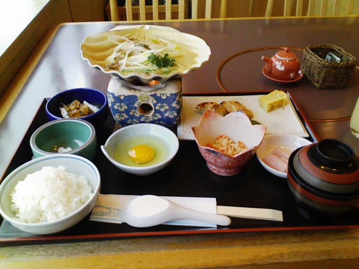 a tray full of various types of japanese food