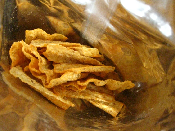 a glass bowl full of dried food inside