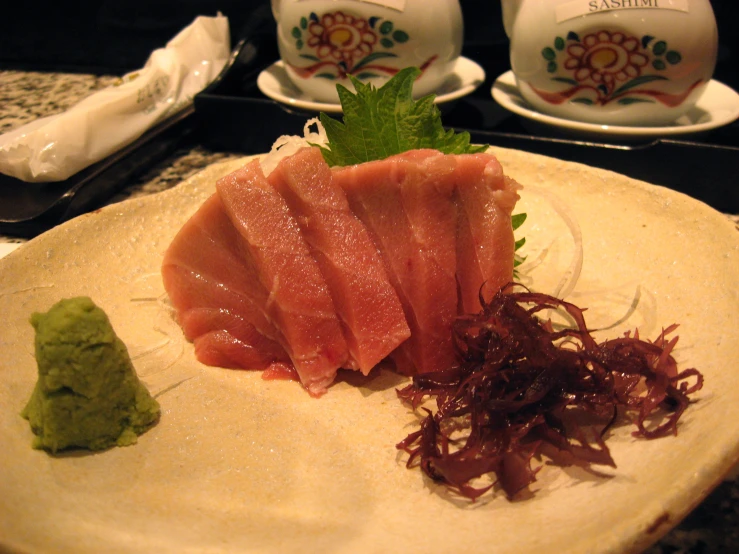 some type of sashimi on a plate