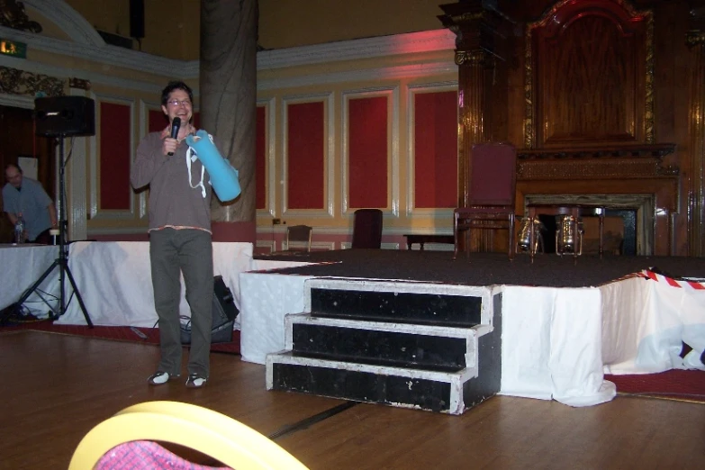 a man standing on a stage with a microphone