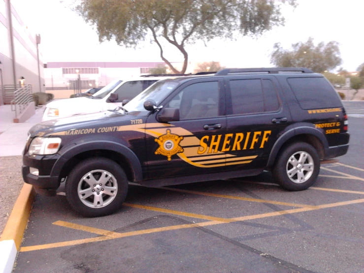 a sheriff van parked in a parking lot