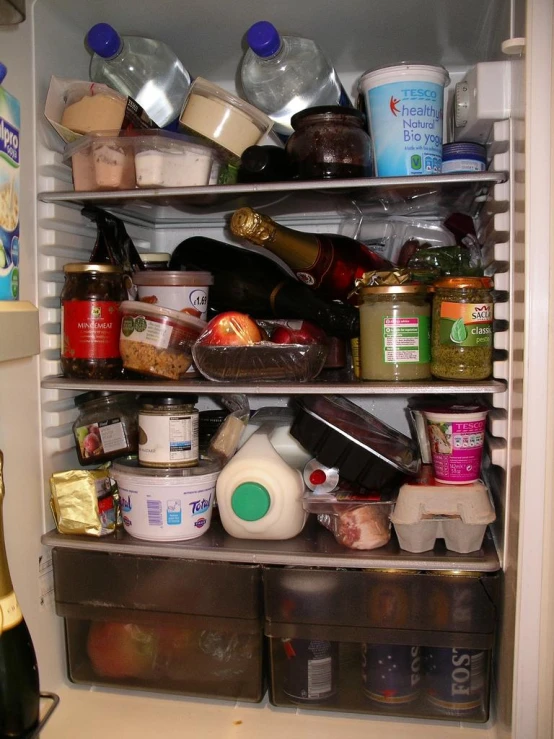 an open fridge with food in it