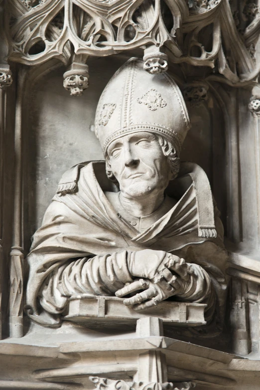 a statue with an italian catholic symbol in front of a church