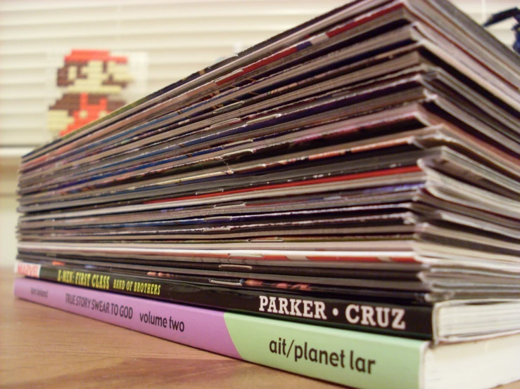 a stack of cds stacked on top of each other