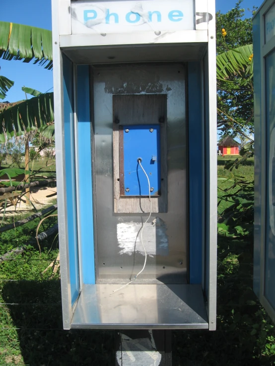 the telephone booth has an electric plug in it