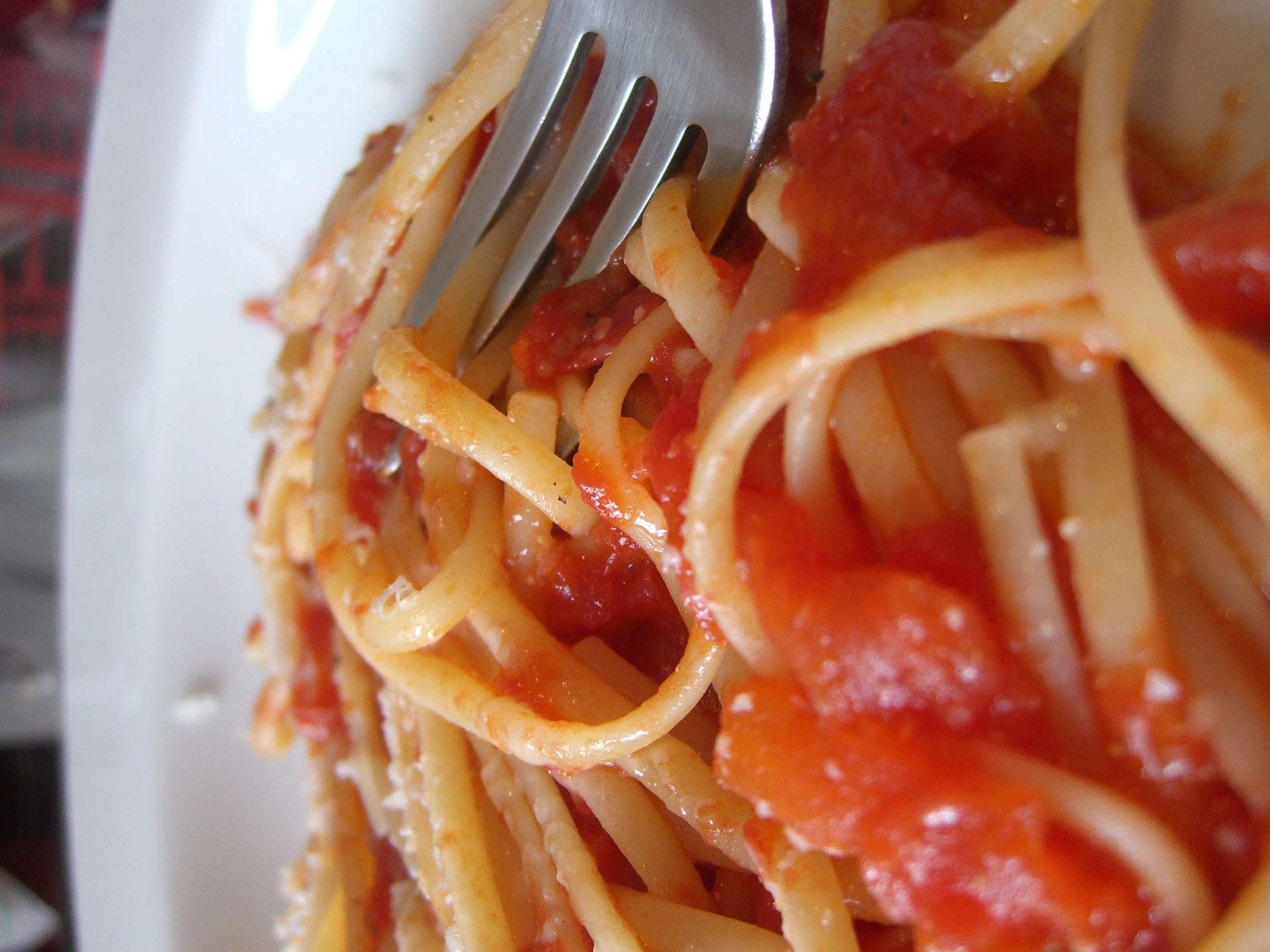 a plate of spaghetti with sauce and meatballs