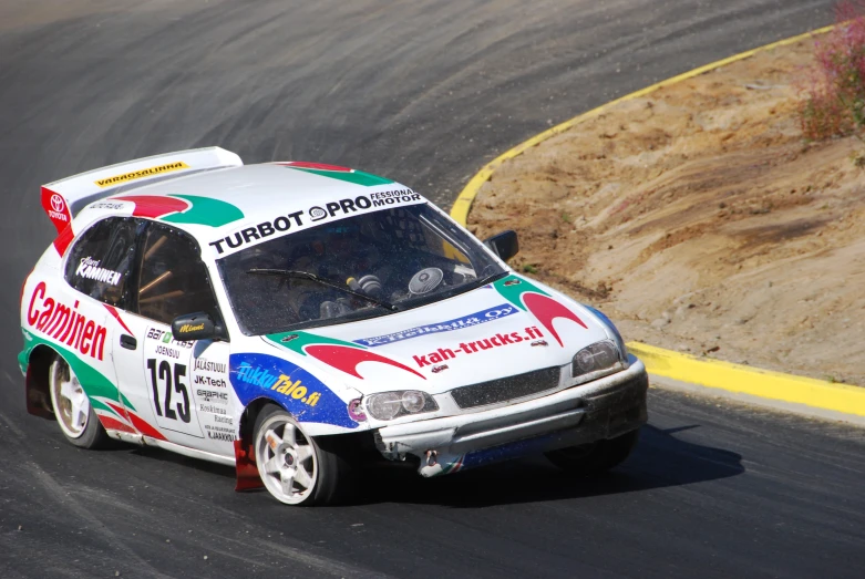 a person driving on a race car in a street