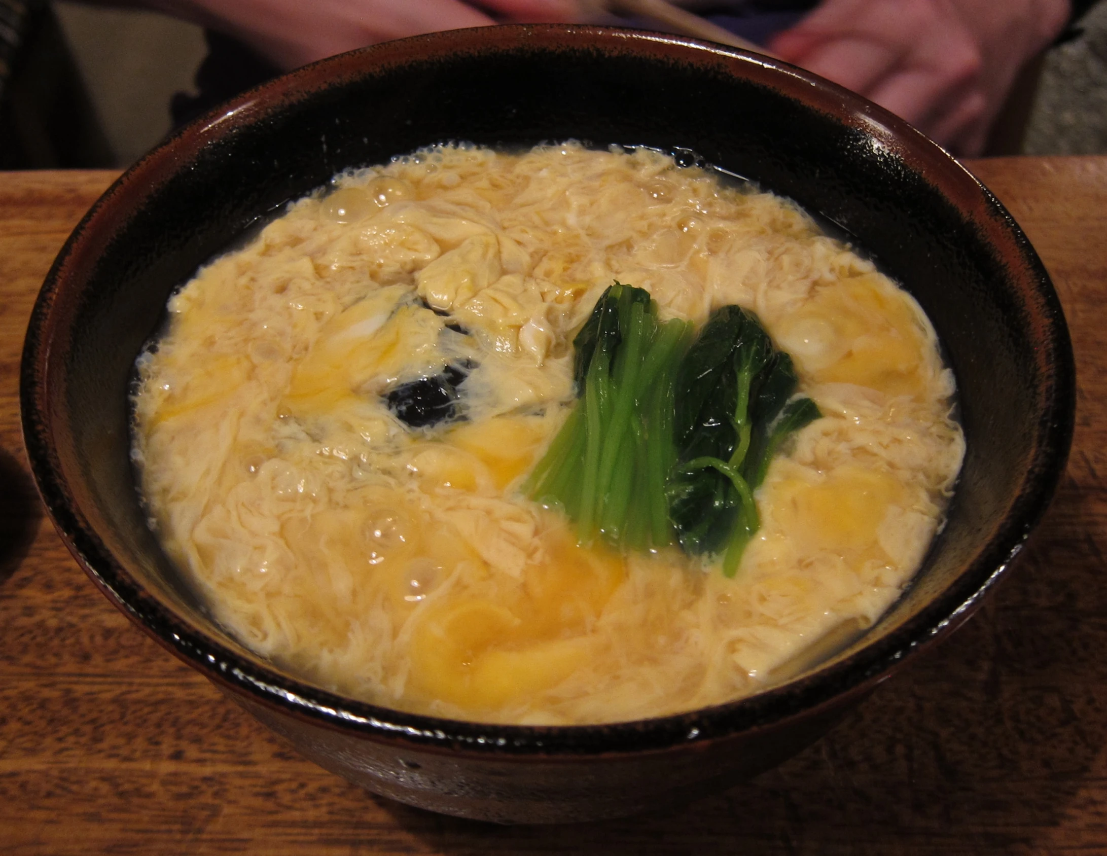 a bowl filled with vegetables and a rice dish