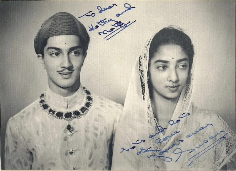 an indian man and woman, dressed in traditional costume