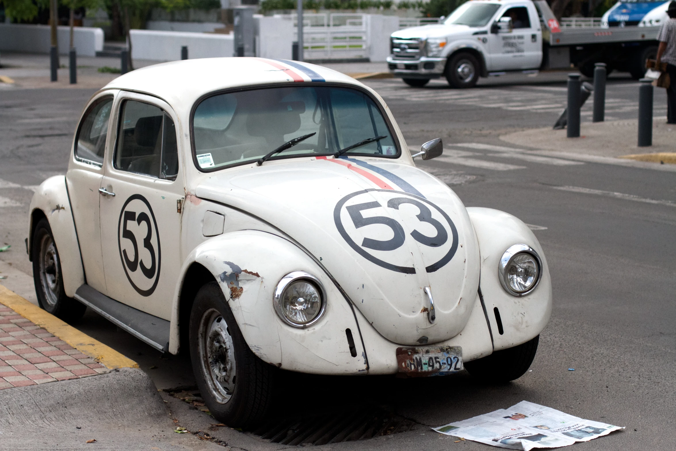 a white car with an interesting number on it