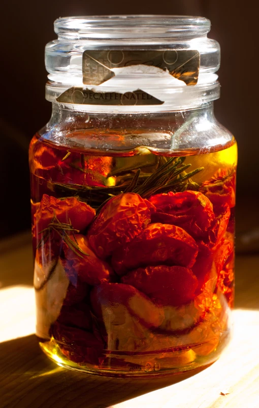 a glass jar filled with lots of vegtables