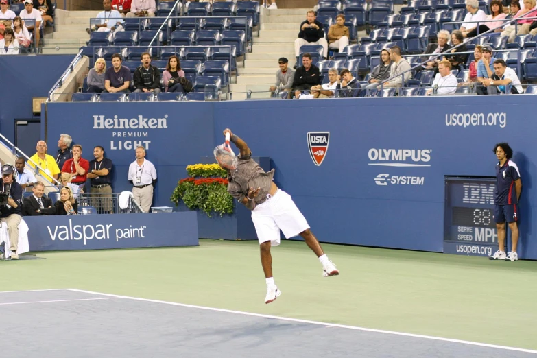 a male tennis player in the middle of a game