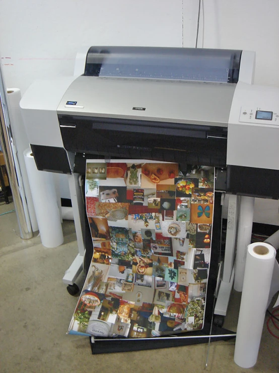 a po and a large printer with papers on it