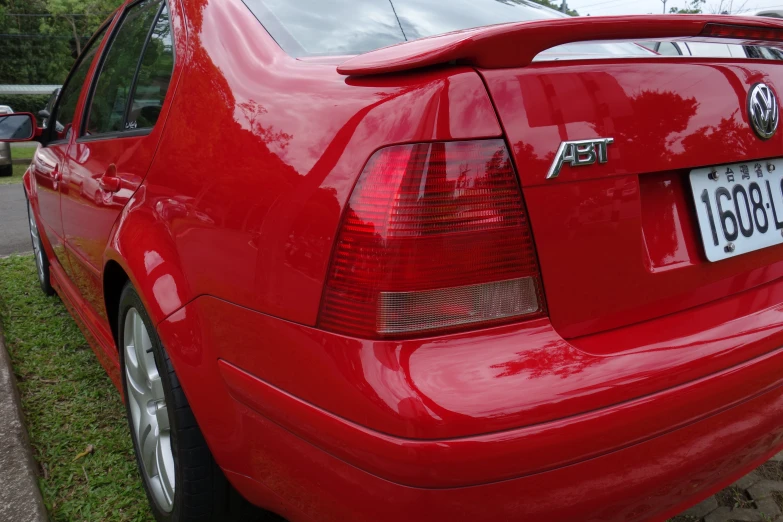 the back end of a red sports car