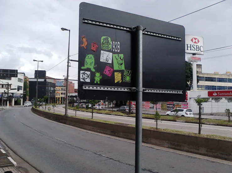 a very large billboard in the middle of an empty street