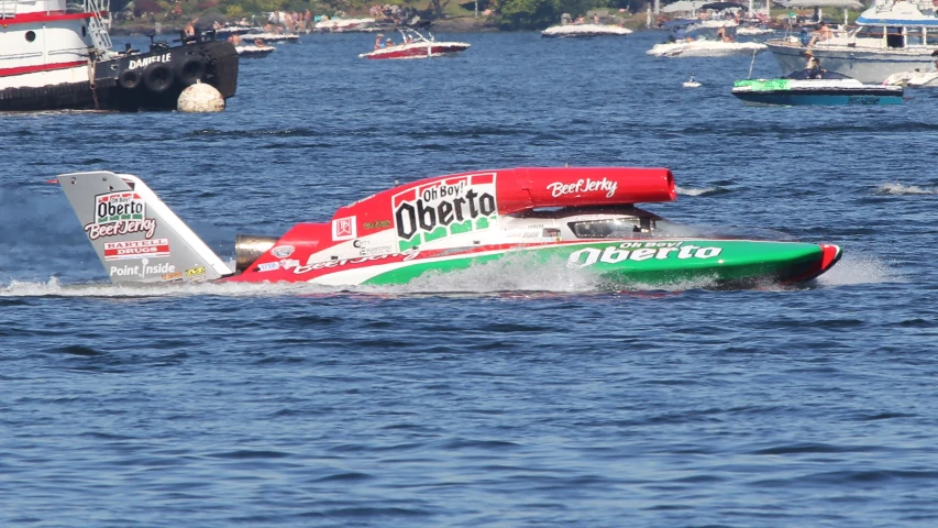 a small boat is riding across the water