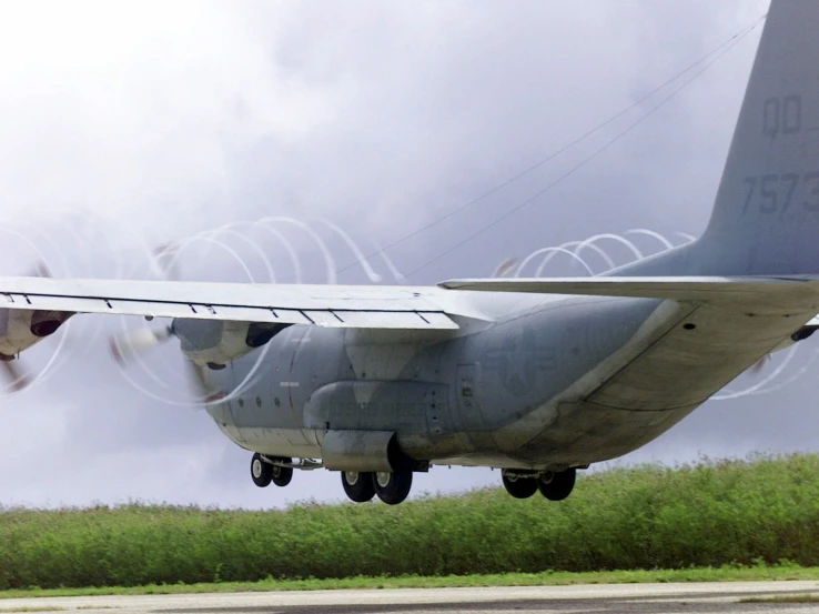 an airplane with the wings down and a camera attached to it's side