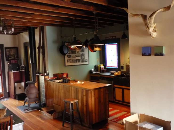 a bar with stools and lights in the living room