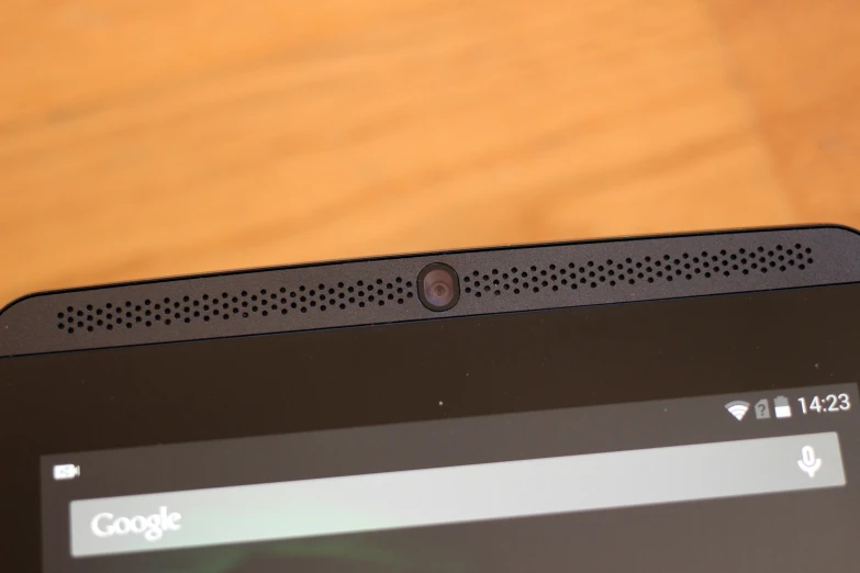 a close up of the keyboard and back panel on a black laptop