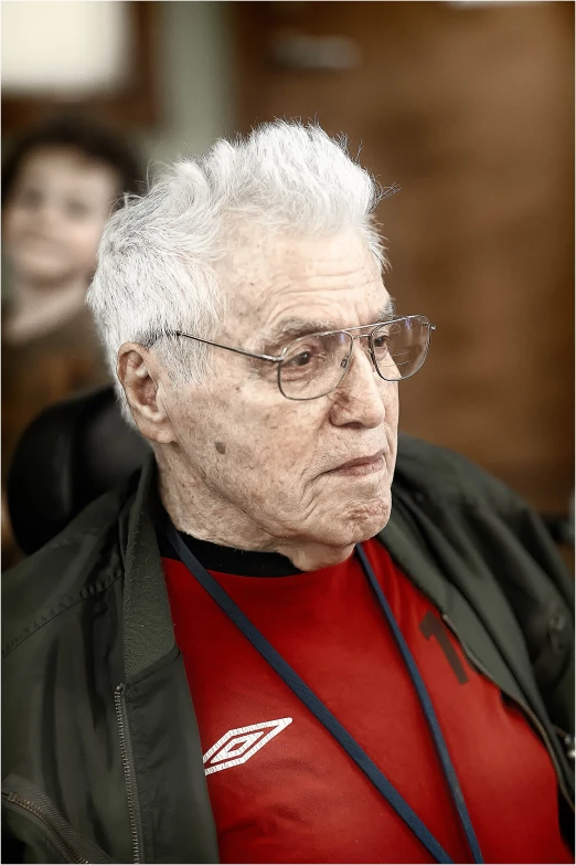 a close up of an older man in glasses