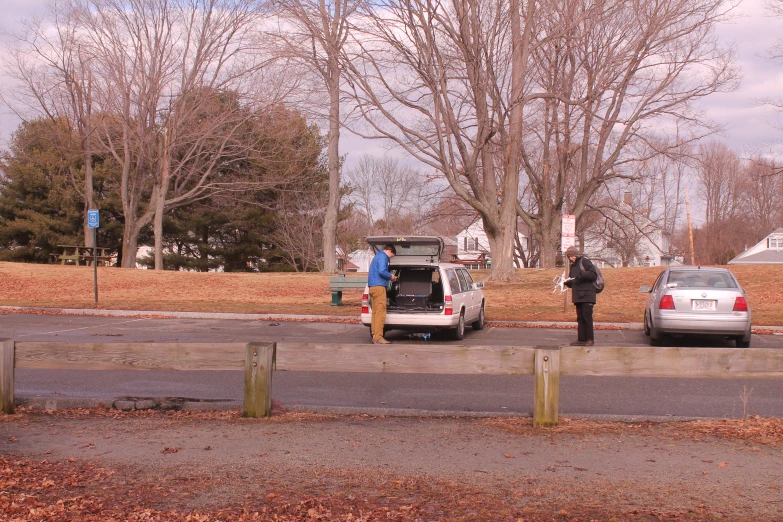 a van is parked and people are loading it