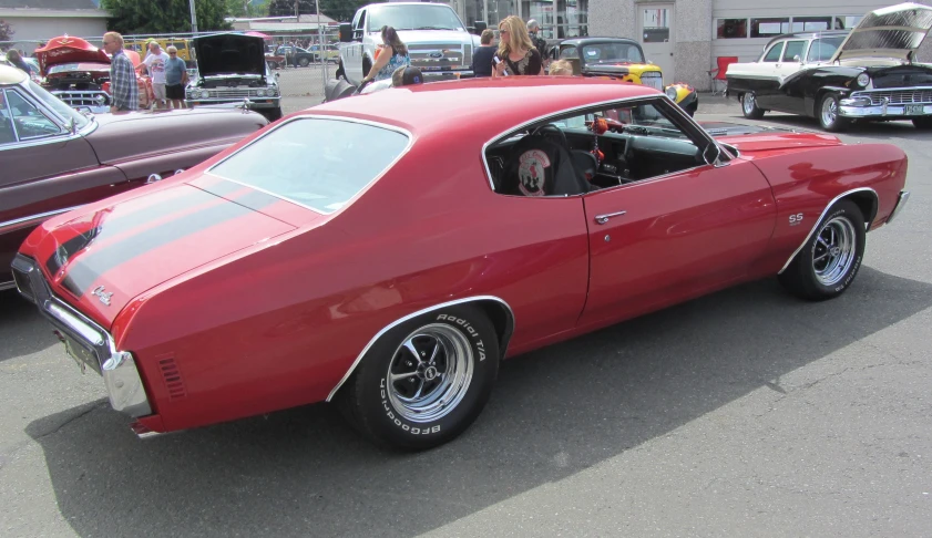 a red car parked in the parking lot