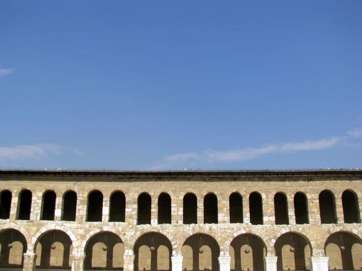 an arched archway in a brick building