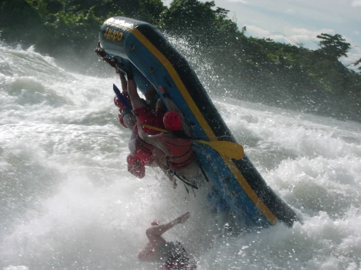 people are riding in a boat in the water