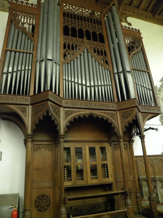 there is a large pipe organ on the wall