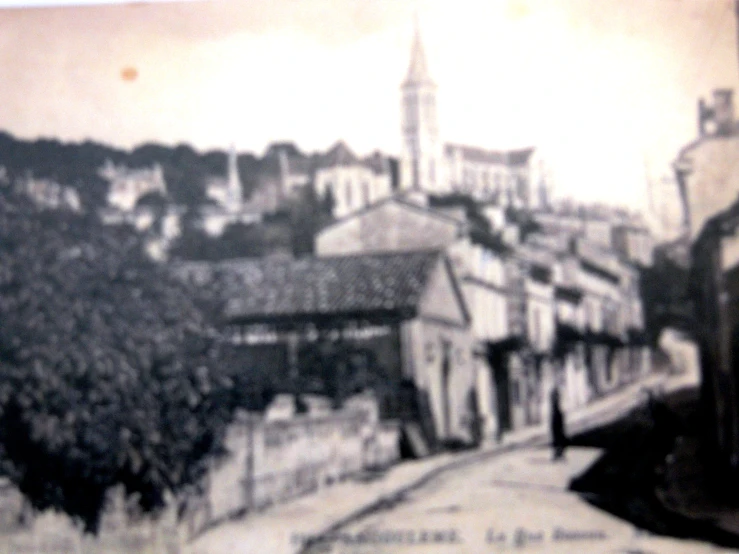 an old picture of a town with many buildings