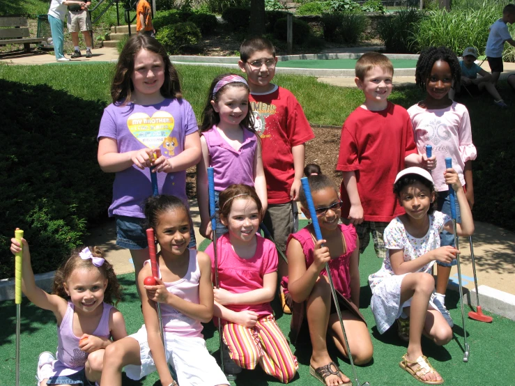 a group of children posing for a po together