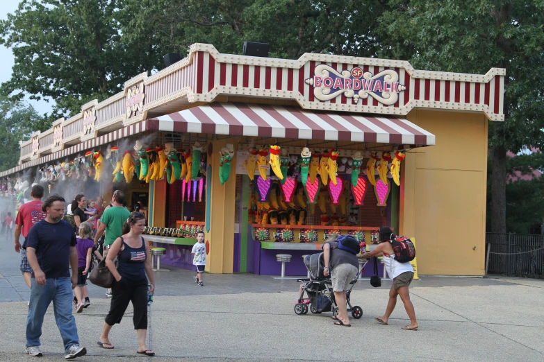 people are walking outside an outdoor fair