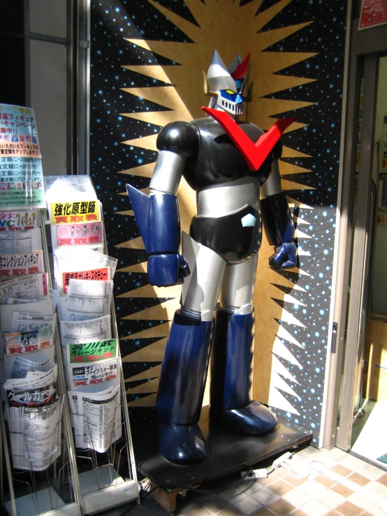 a big robot statue in front of a store