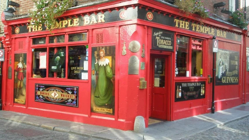 a large red restaurant with a green curtain on the front