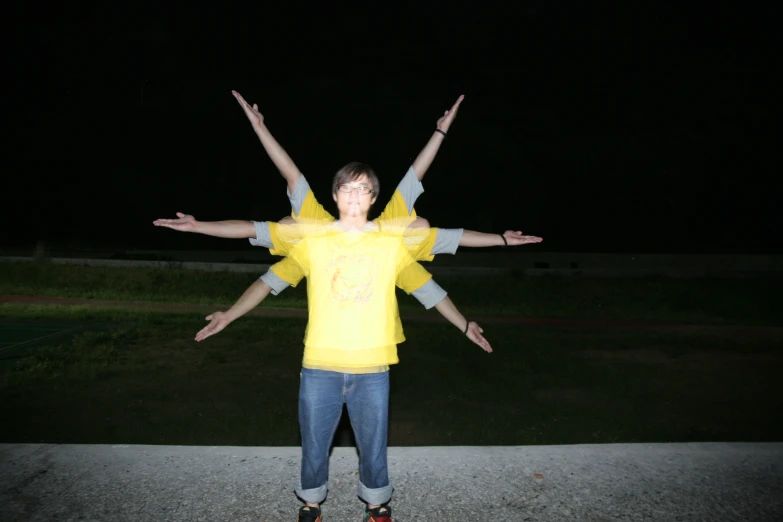 the three people stand in a circle and have their hands up