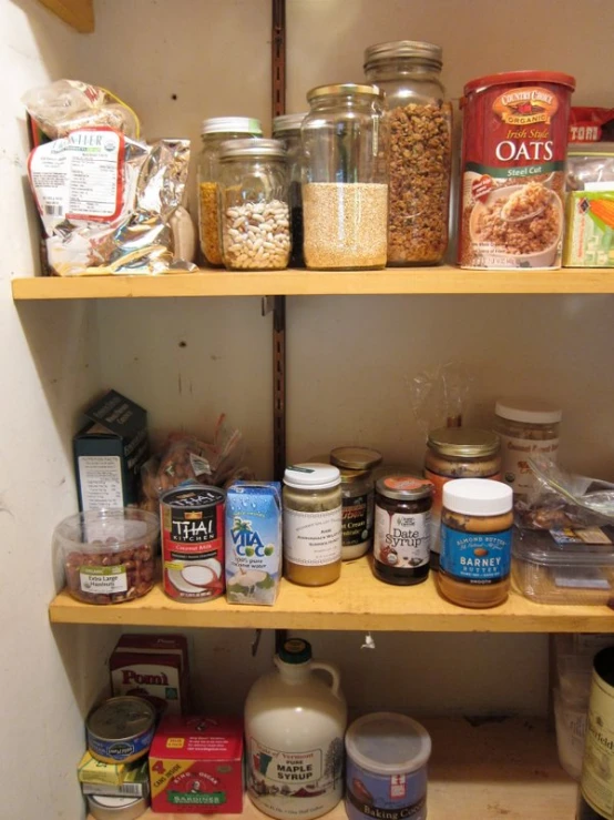 a shelf with food items in it and several other containers on it