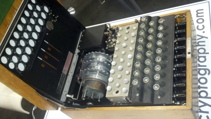 an old typewriter and some other typewriters on display