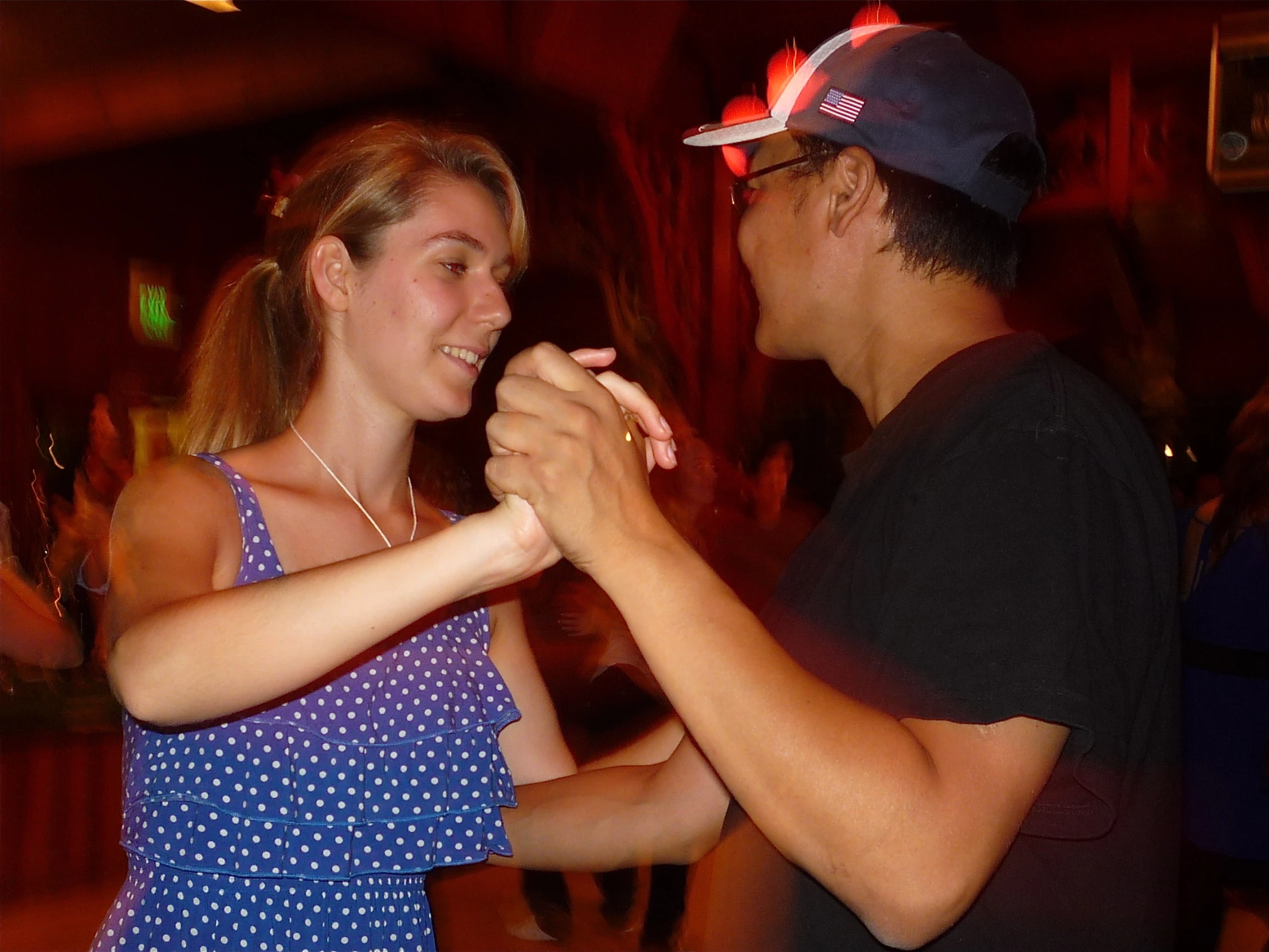 a man and a woman dance at an event