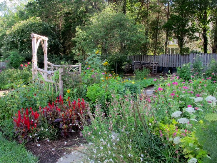 a lush green field filled with lots of flowers