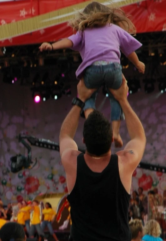 the man and woman are performing a stunt