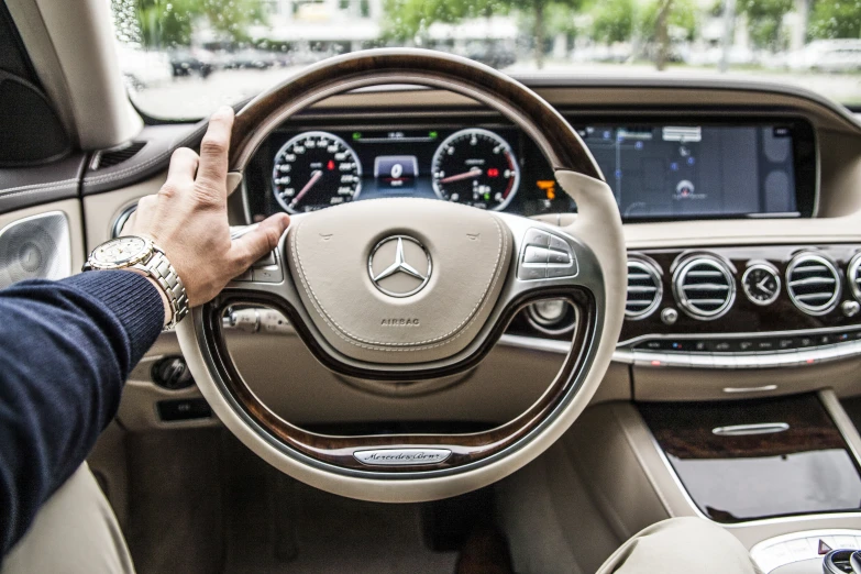 a mercedes cla in the drivers hand