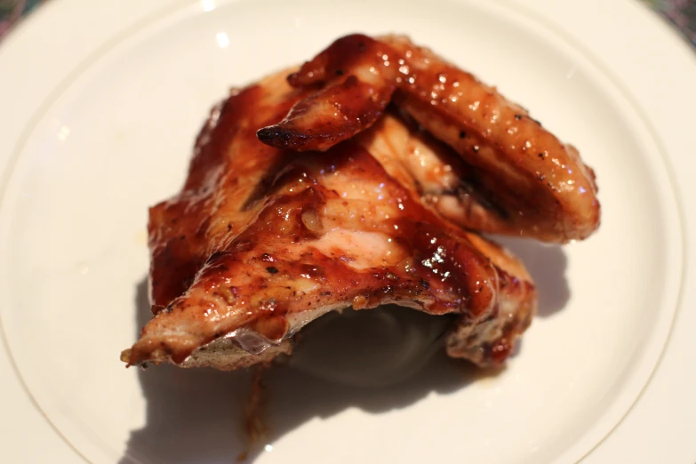 grilled meat with ketchup on white plate