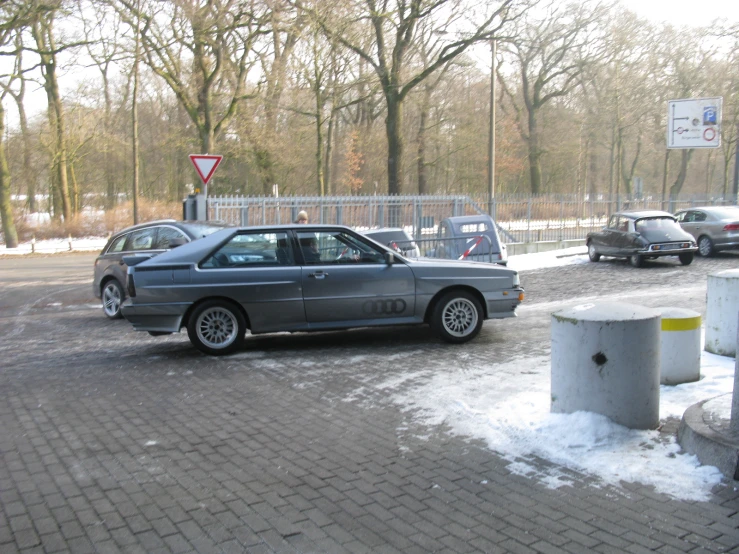 a silver car parked in a parking lot